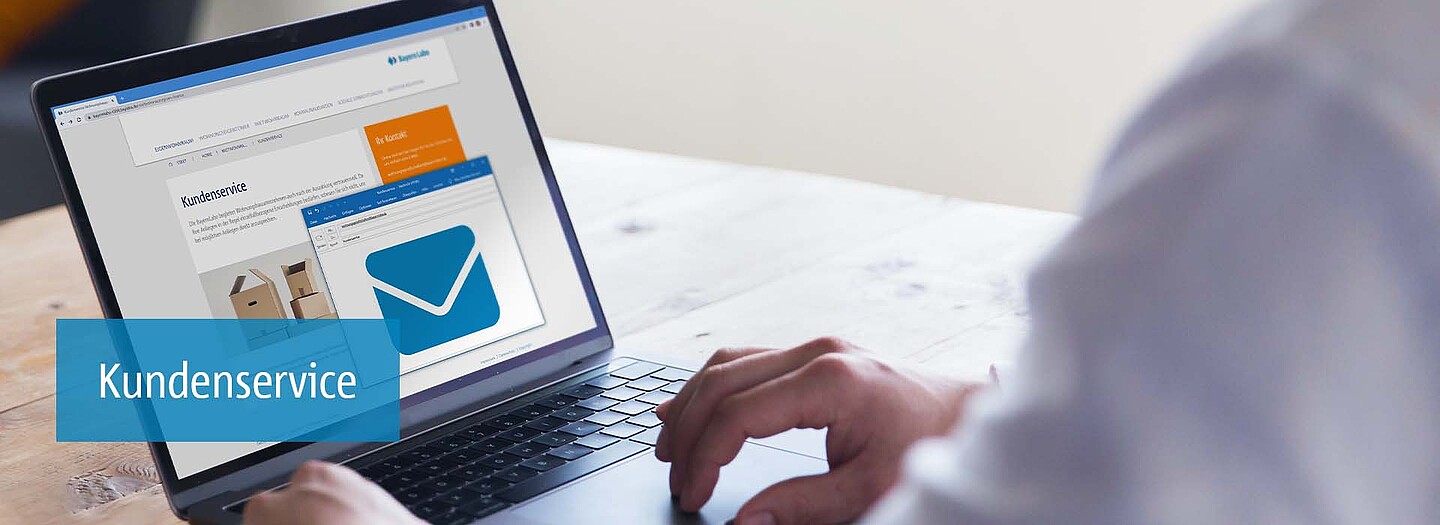 Kundenservice für Wohnungsbaugesellschaften | BayernLabo Kundenservice auf Laptop: Kundenservice zur Mietwohnraumförderung der BayernLabo